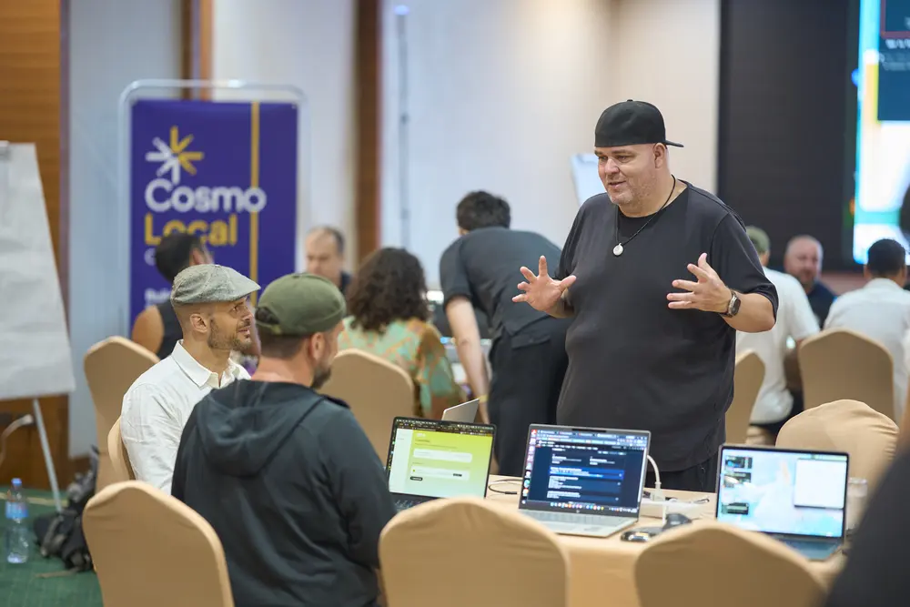 A mentor with a team at the hackathon