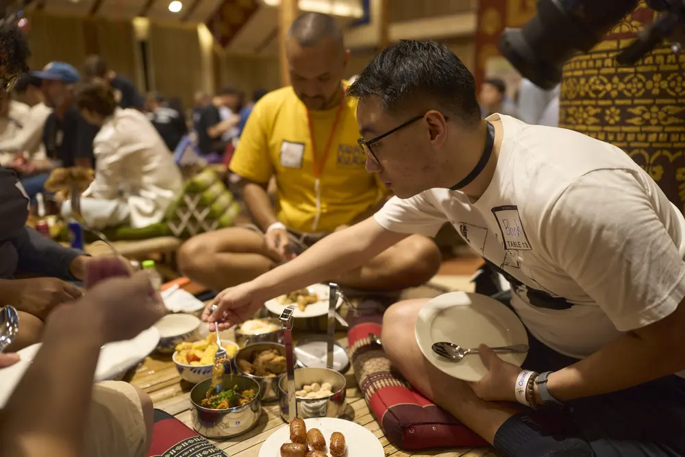 Sharing dishes at the Cosmo Local Pot Luck